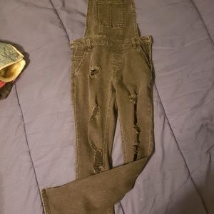 Black distressed skinny overalls